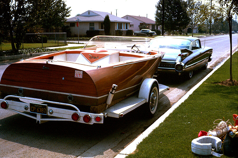 Lancer Imperial boat - behind mom's Cad when it was still black. 
